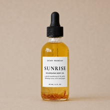 Load image into Gallery viewer, Bottle of Dewy Monday Sunrise Nourishing Body Oil on a beige background

